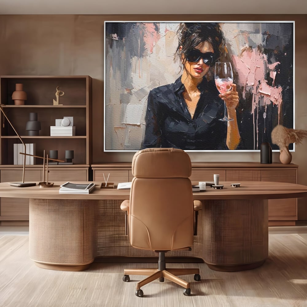 Tablou canvas cu tablou canvas cu femeie si pahar de vin, in rama de aluminiu argintiu, pe perete intr-un birou